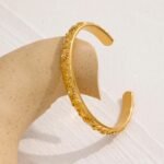 Celestial Charm Bangle: Golden Stainless Steel Moon, Star, Sun Bracelet, Stylish Open Wrist